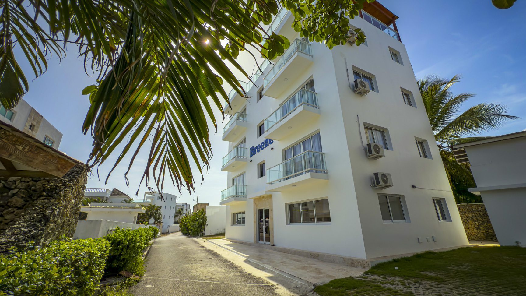 buyDRproperty Exterior of Breeze building with balconies in sunny Dominican Republic Sosua Real Estate
