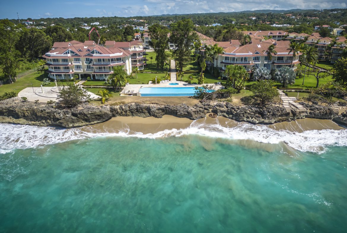 buyDRproperty Luxury condos with pool overlooking a turquoise ocean in the Caribbean. Sosua Real Estate