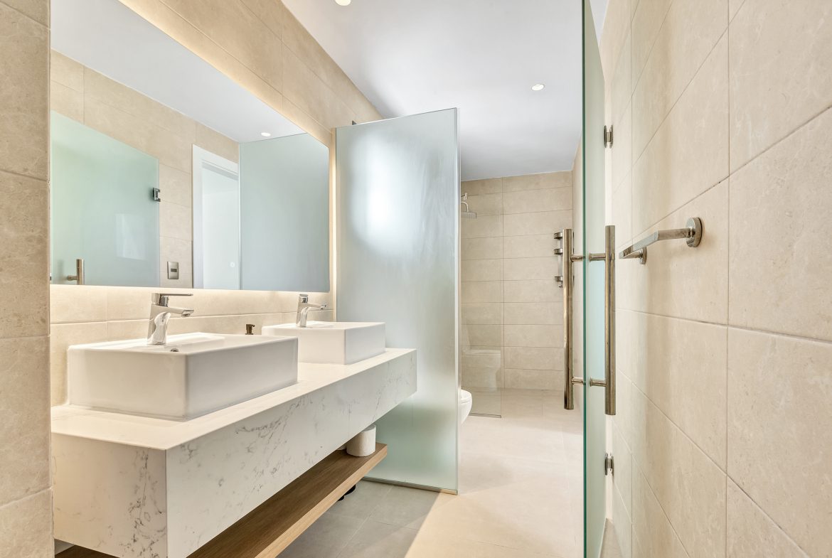 buyDRproperty Golden retriever puppy in a basket with a red blanket. Sosua Real Estate