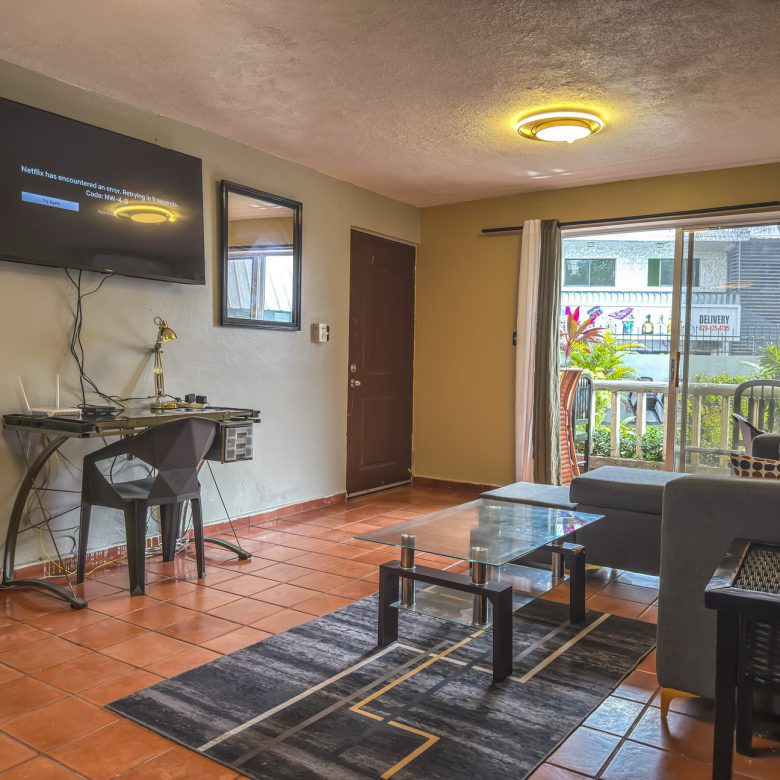 Buydrproperty Cozy Living Room with Tv Displaying a Netflix Error Message Glass Coffee Table and Outdoor View Sosua Real Estate Buydrpropertycom Buydrpropertycom