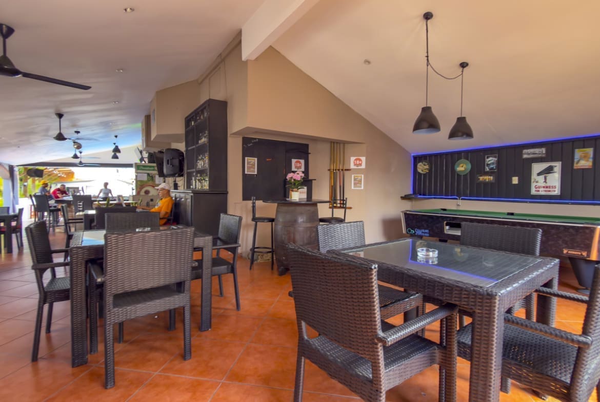 buyDRproperty Bar with pool table, seating, and decorative items Sosua Real Estate