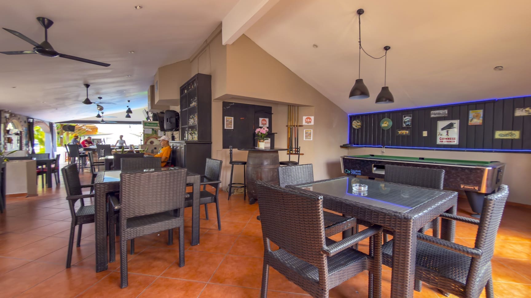 buyDRproperty Bar with pool table, seating, and decorative items Sosua Real Estate