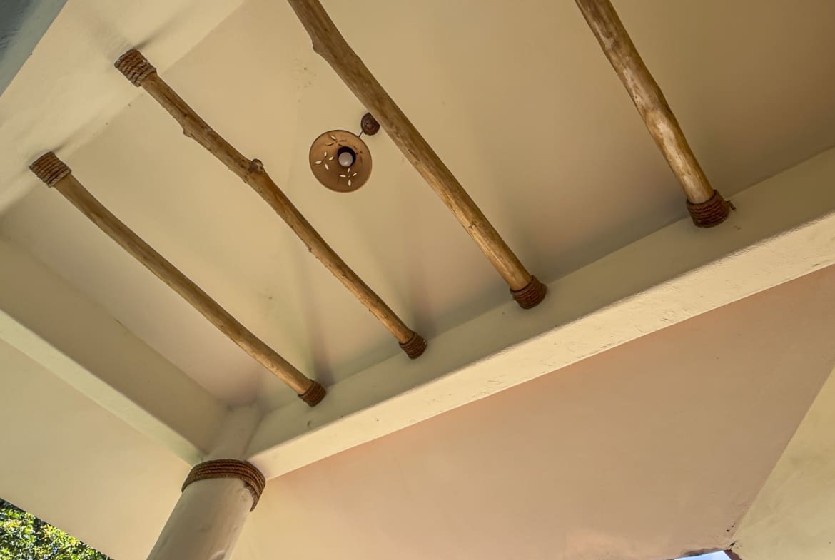 buyDRproperty Ceiling with wooden beams and a light fixture Sosua Real Estate