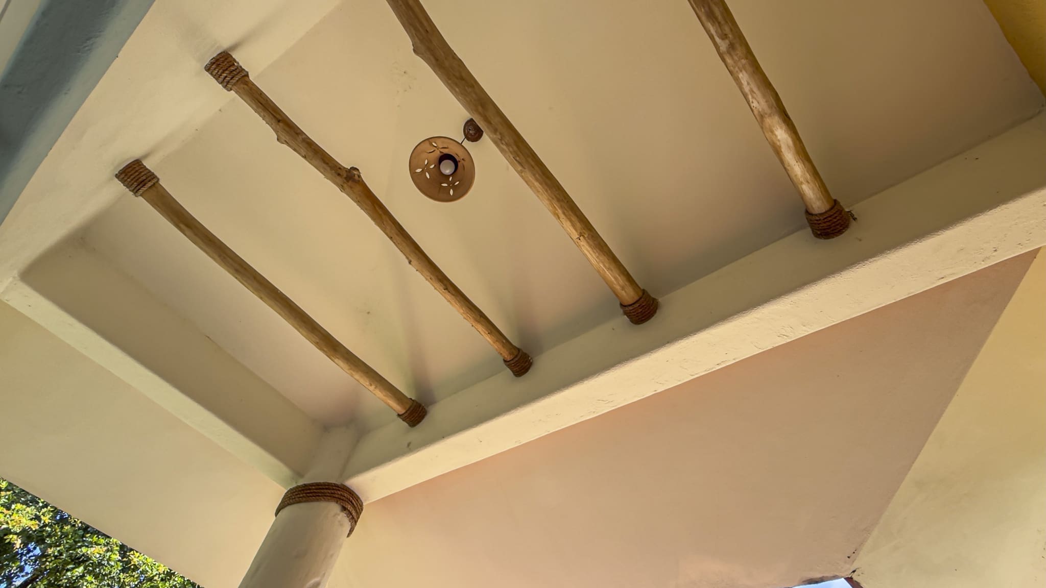 buyDRproperty Ceiling with wooden beams and a light fixture Sosua Real Estate