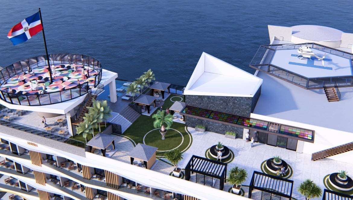 Aerial view of a modern rooftop resort by the ocean, featuring a circular glass-rail deck, palm trees, colorful seating, and a helipad.