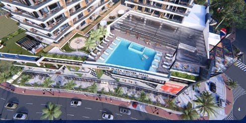 buyDRproperty Puerto Plata Center Mall aerial view with pool, shops, and apartments Sosua Real Estate