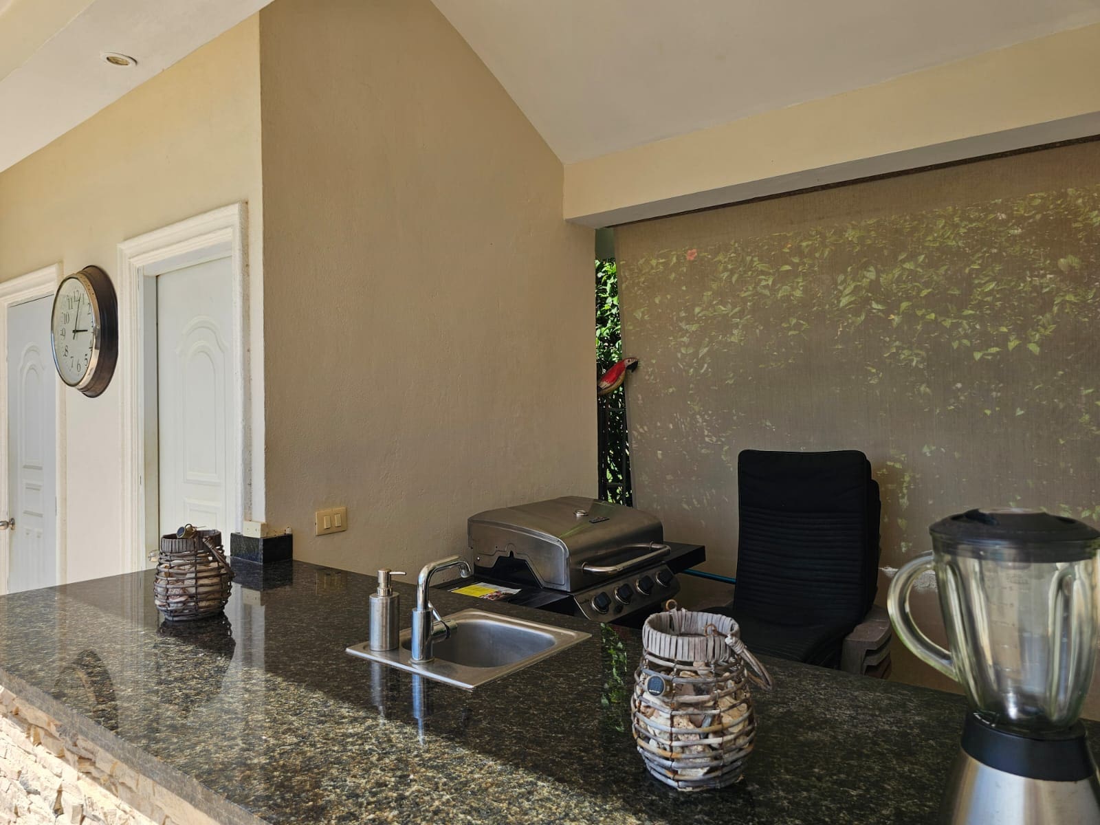 buyDRproperty Outdoor kitchen bar with grill, sink, and blender, perfect for entertaining. Sosua Real Estate